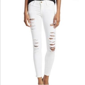 Frame le skinny de jeanne white distressed jeans